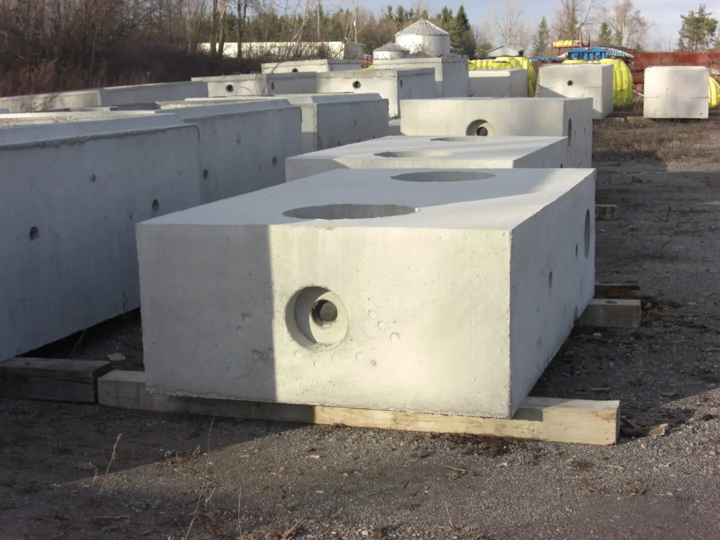 Concrete blocks with holes on pallets.