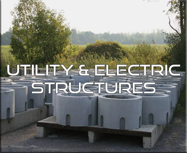 A bunch of concrete structures sitting on top of pallets.