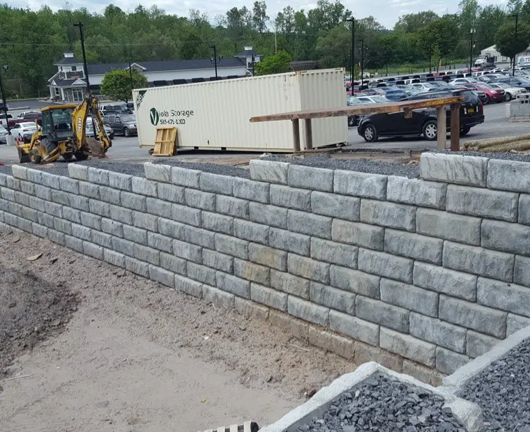 A wall that is made of concrete blocks.