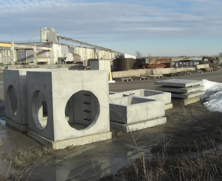 A concrete block sitting in the middle of a field.