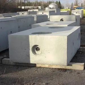 Concrete blocks arranged in a construction yard.